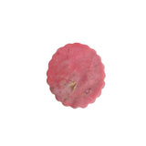 Texture and color variations in pink rhodonite carved medallion