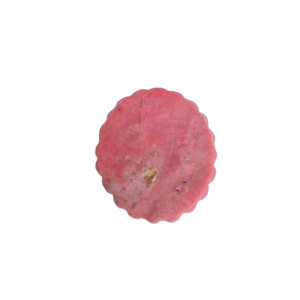 Texture and color variations in pink rhodonite carved medallion