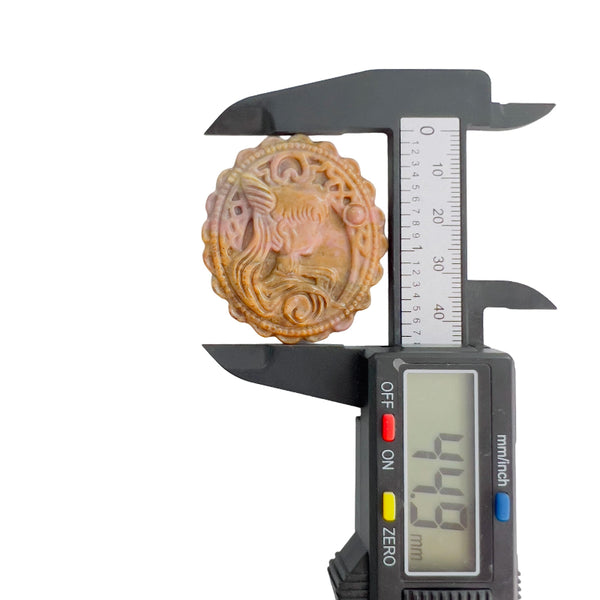 Digital caliper showing Rhodonite magical girl pendant height measurement