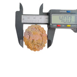 Digital caliper showing Rhodonite magical girl pendant width measurement