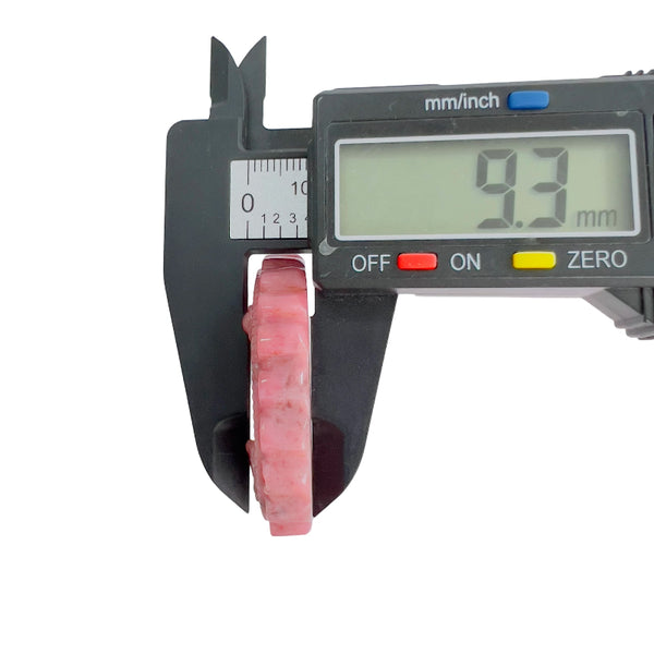 Pink rhodonite carved medallion thickness measurement