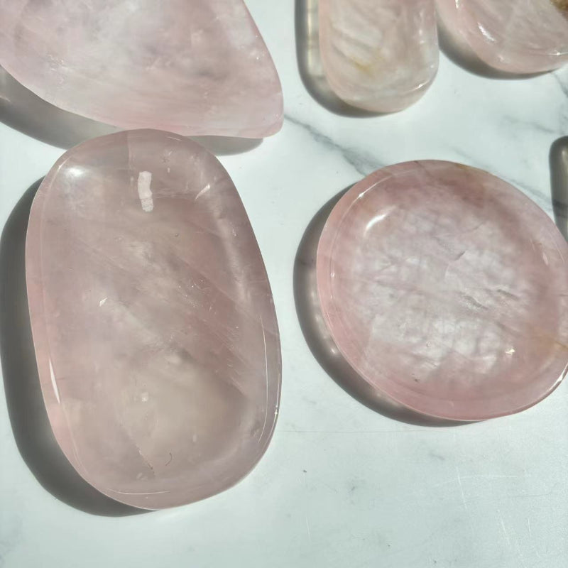 Rose quartz bowl being used for crystal grid healing arrangement