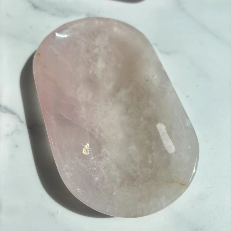 Rose quartz crystal bowl showcasing healing properties and pink hue