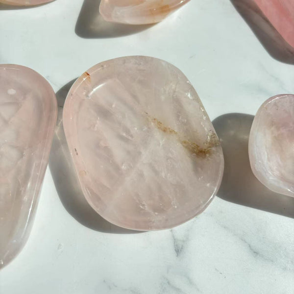 Hand-polished rose quartz crystal bowl with smooth glossy surface
