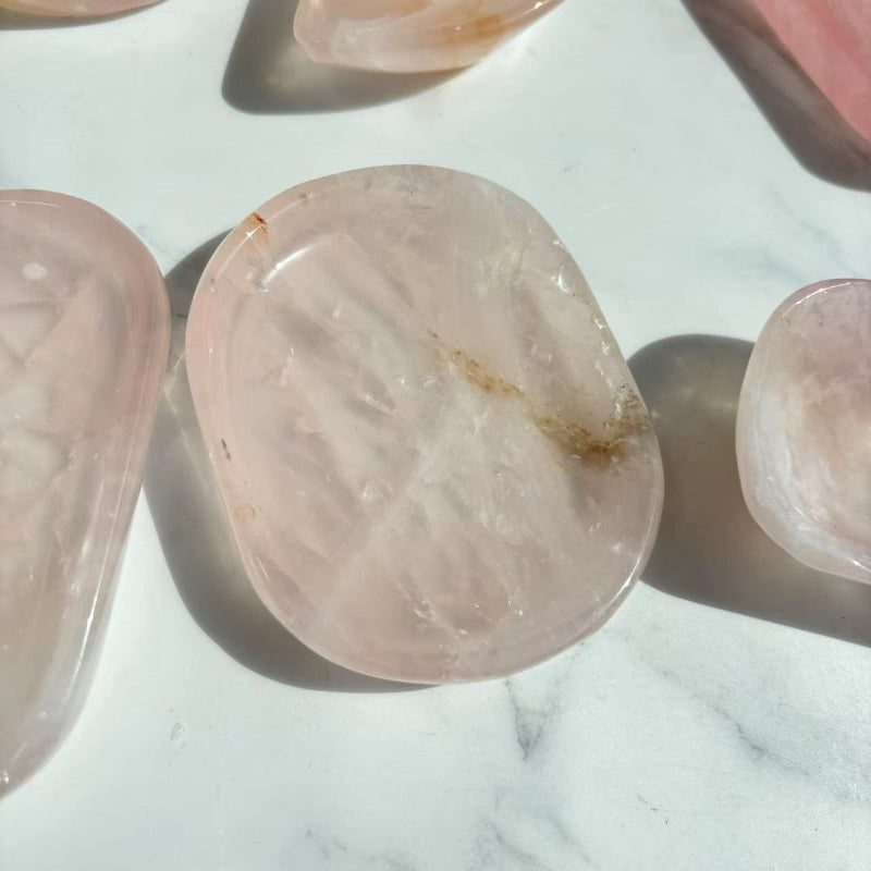 Hand-polished rose quartz crystal bowl with smooth glossy surface