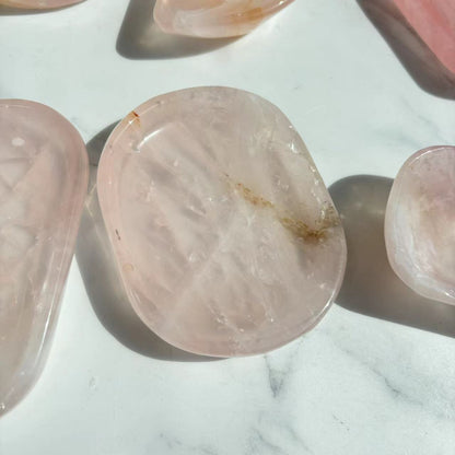Hand-polished rose quartz crystal bowl with smooth glossy surface