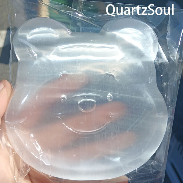 Collection of selenite bear crystal carvings for wholesale buyers