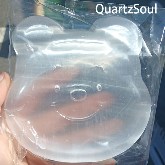 Collection of selenite bear crystal carvings for wholesale buyers