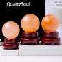 Selenite Crystal Sphere on Wooden Display Stand
