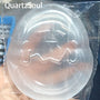 Eggshell selenite crystal carving displayed on stand