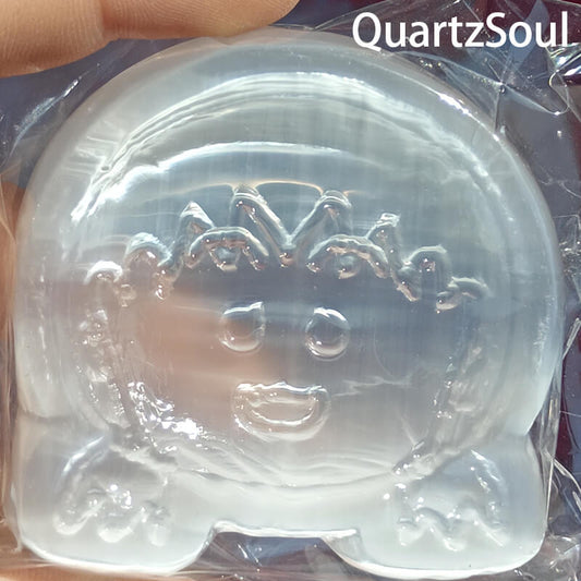Front view of selenite girl crystal with delicate facial features
