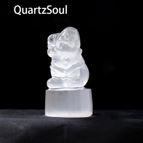 White selenite Santa Claus sculpture emitting purifying energy for crystal healing