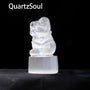 White selenite Santa Claus sculpture emitting purifying energy for crystal healing