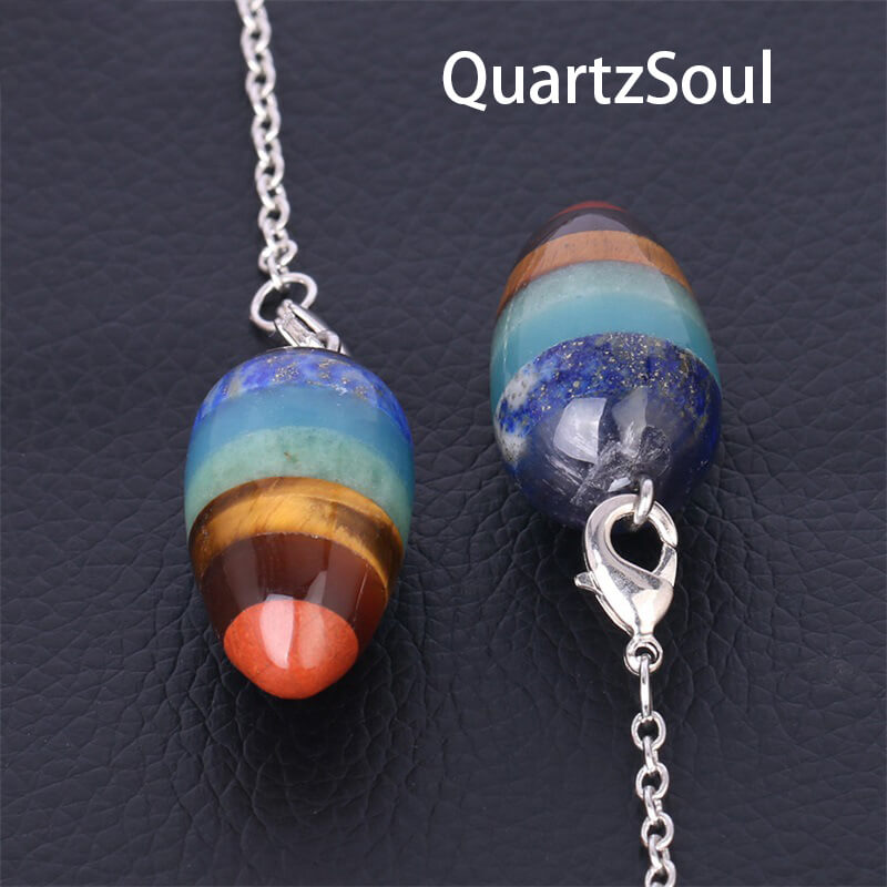 Seven layer crystal pendulum for dowsing with natural stone segments