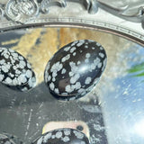 Unique Patterns in Wholesale Snow Obsidian Palm Stones