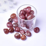 Natural Strawberry Quartz tumbled stones in glass bowl, pink healing crystals