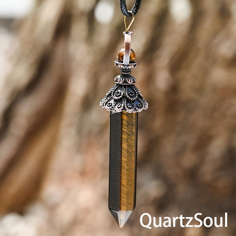 Tiger eye hexagonal crystal pendulum with ornate metalwork