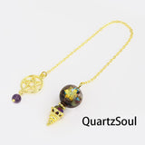 Colorful tourmaline crystal pendulum with pentagram charm for chakra divination