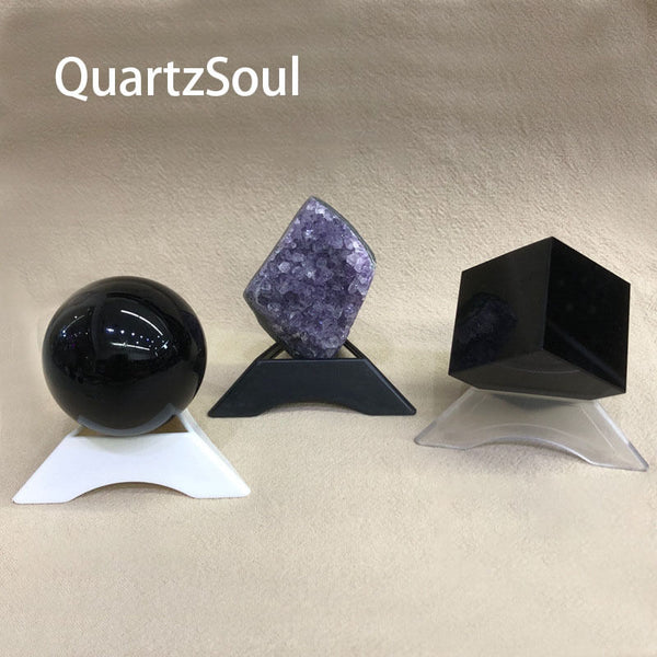 Clear triangular hollow crystal ball stand displaying craftsmanship details