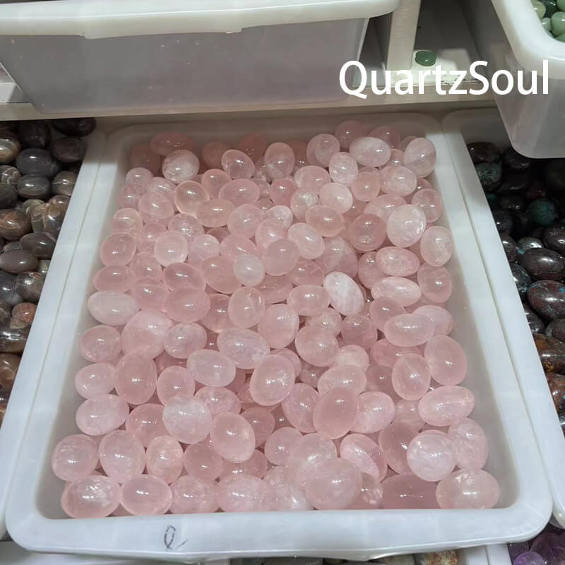 Premium tumbled rose quartz crystals in wholesale bulk tray from QuartzSoul crystal suppliers