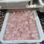 Premium tumbled rose quartz crystals in wholesale bulk tray from QuartzSoul crystal suppliers