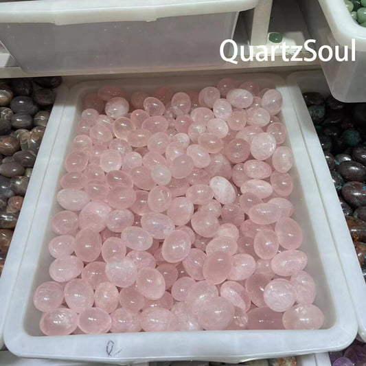 Premium tumbled rose quartz crystals in wholesale bulk tray from QuartzSoul crystal suppliers