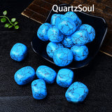 Polished blue turquoise tumbled stones arranged in black display dish showing matrix veining