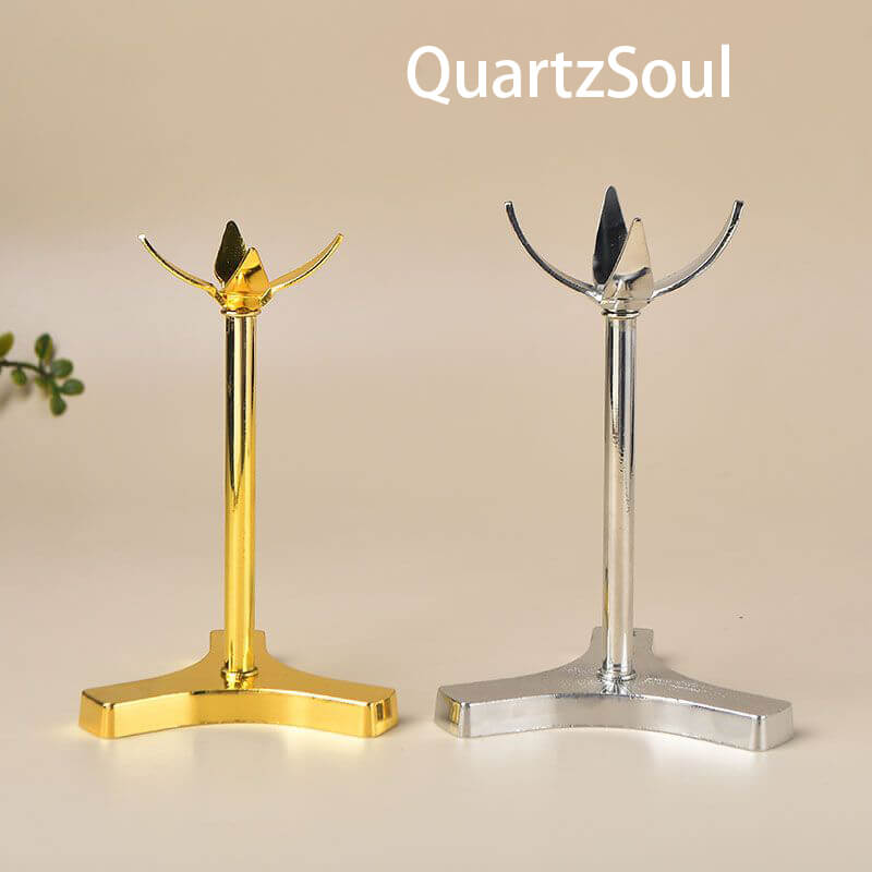 Elegant clover-shaped crystal ball stands in gold and silver metal finish for displaying crystal spheres