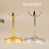 Elegant clover-shaped crystal ball stands in gold and silver metal finish for displaying crystal spheres