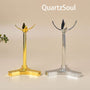 Elegant clover-shaped crystal ball stands in gold and silver metal finish for displaying crystal spheres