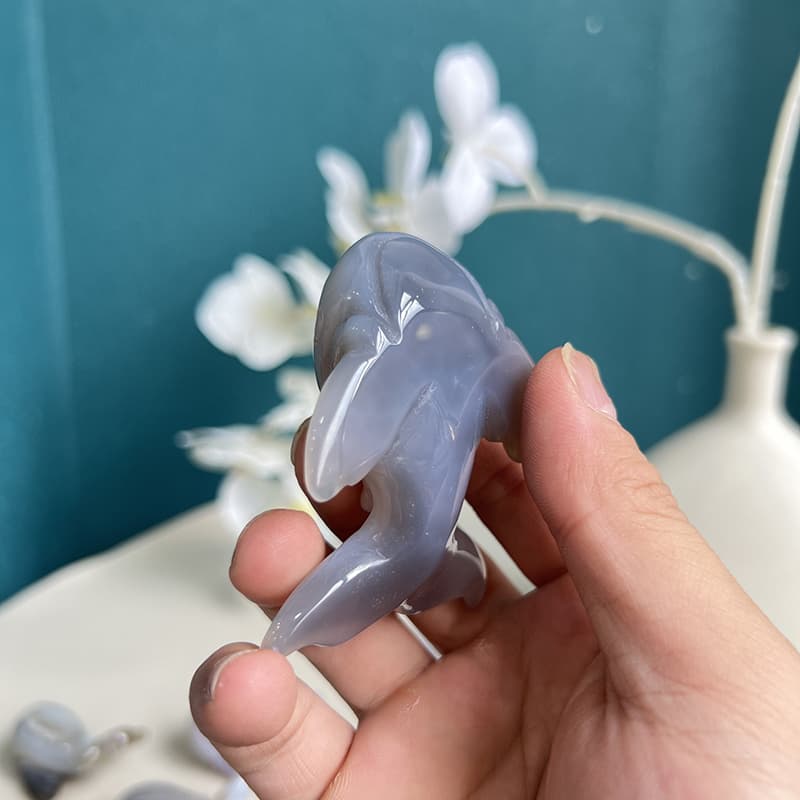 Close-up detail of handcrafted whale shaped agate crystal