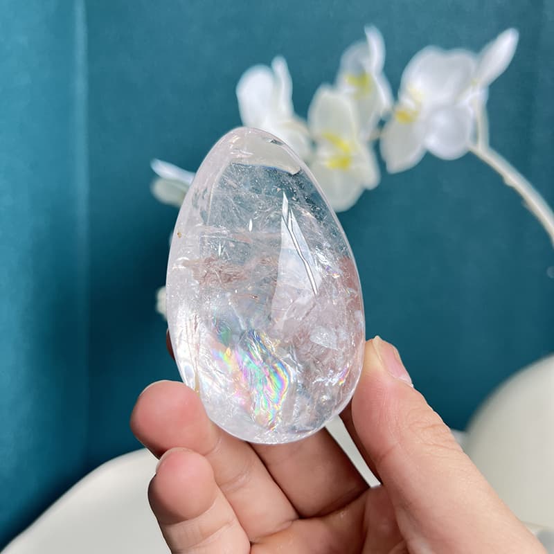White Smoky Quartz Crystal Egg Held in Hand Showing Size