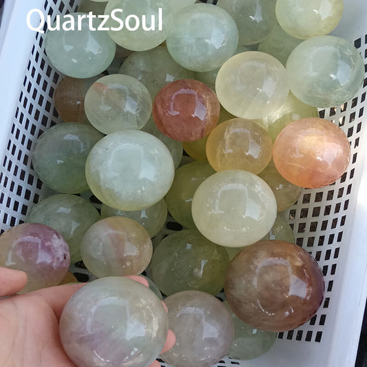 Natural wholesale Fluorite crystal spheres in various colors for bulk purchase