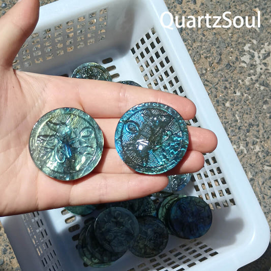 Round blue labradorite crystal carving with vibrant blue flash, wholesale crystal supply
