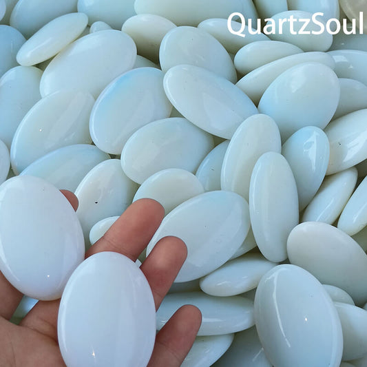 Smooth white oval opal palm stones for wholesale crystal suppliers
