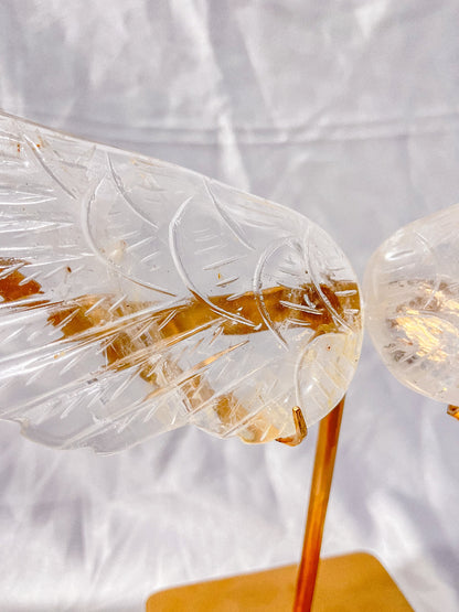 Crystal wings healing ornament on gold stand side view