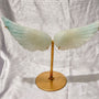 Natural jade crystal angel wings mounted on gold stand for crystal healing