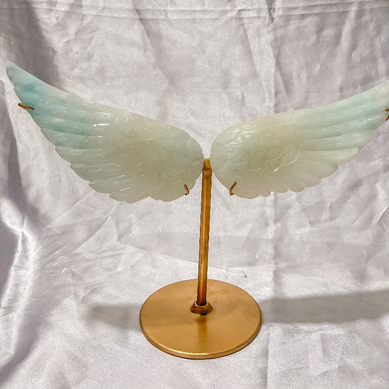 Natural jade crystal angel wings mounted on gold stand for crystal healing