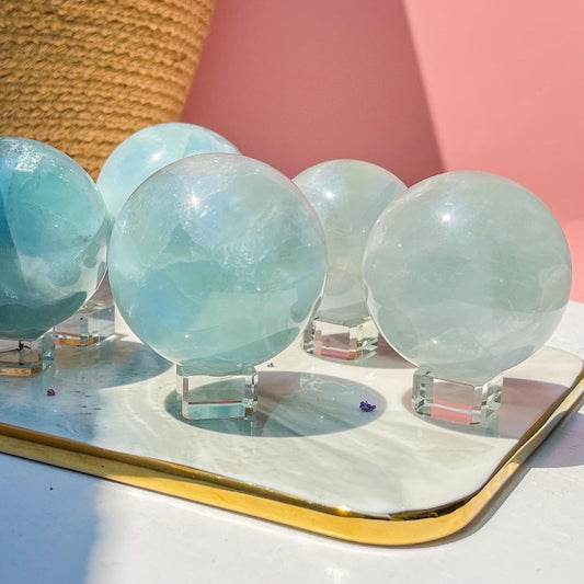 Light green fluorite crystal sphere with display stand