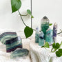 Natural fluorite crystal tower and slab collection with vibrant green and purple banding