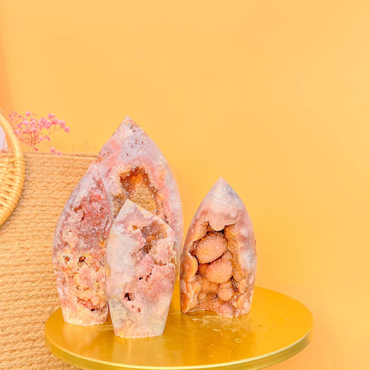 Natural pink amethyst druzy crystal point with sparkling quartz formation on gold platform