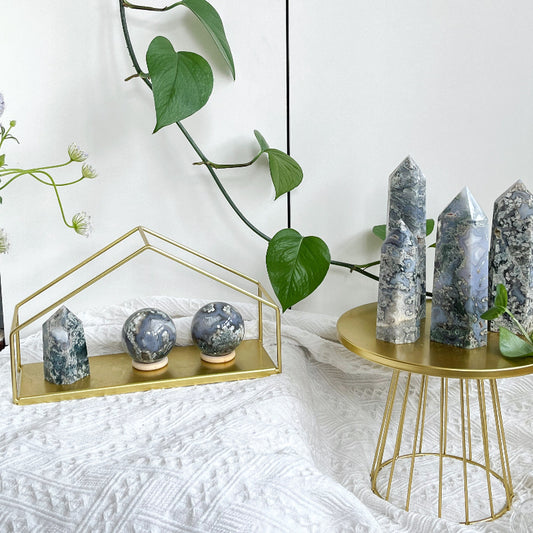 Premium moss agate crystal point with natural mica inclusions displaying verdant green patterns